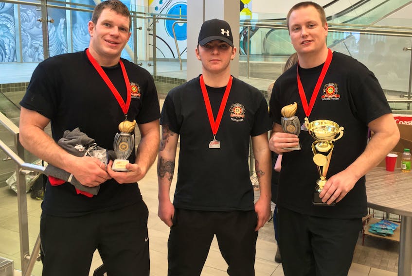 Members of the Scotchtown Volunteer Fire Department, from left, Evan Boudreau, Brett Binder and Adam Woods received awards at the Stair Heroes event in Halifax, a fundraiser for the Lung Association of Nova Scotia. Boudreau won the stairs competition and Woods the gear up challenge, the only two events for firefighters. Binder was acknowledged for his fundraising efforts. CONTRIBUTED