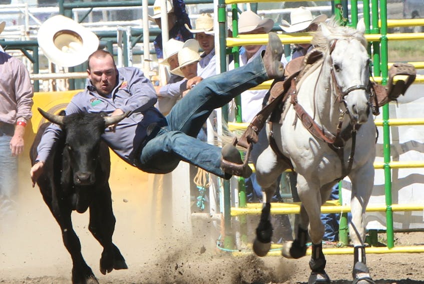 Chance Butterfield competes in the steer wrestling event at the Strathmore Stampede in this file photo from 2013.
