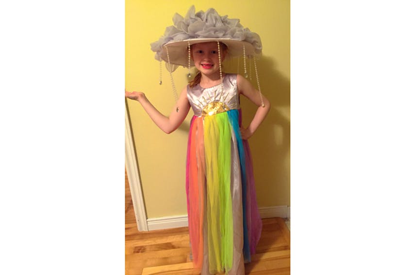 Does it come in my size? This is the perfect Halloween costume for a meteorologist! Neelie Bennett aka Miss Weather tells me the cloud on her head is making it rain while the sun is shining and creating a lovely rainbow! You'll find Miss Weather trick-or-treating with her two sisters in Big Pond  in Cape Breton N.S.