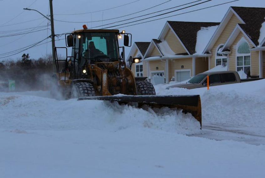 A City of Summerside snowplow drives through a snowdrift after this week's storms hit the Island.