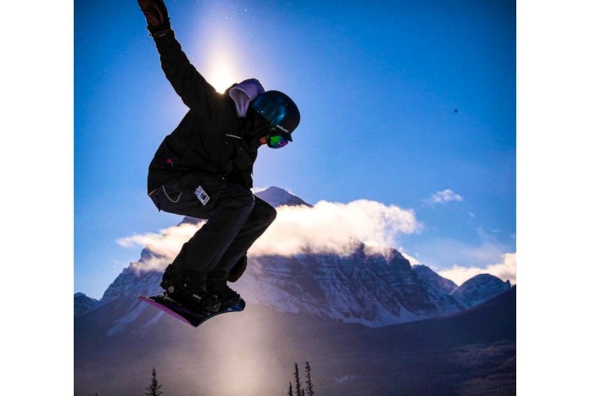 A snowboarder takes to the air at Lake Louise ski area west of Calgary. The resort's weekend forecast is calling for  warmer temperatures.