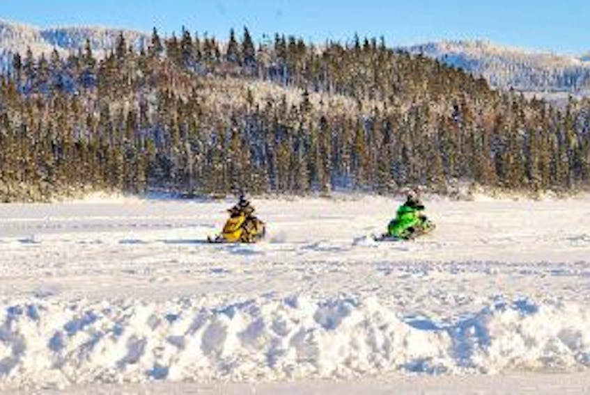 ['STAR FILE PHOTO <br />Snowmobiles are seen on Tippings Pond in Massey Drive.']