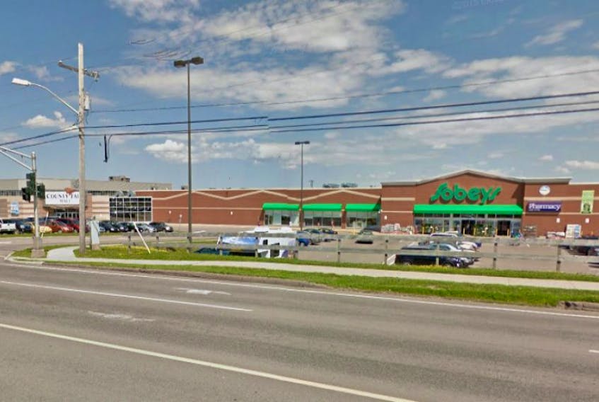 A Summerside police vehicle struck a woman while she was walking in the Sobeys parking lot at the County Fair Mall Monday.