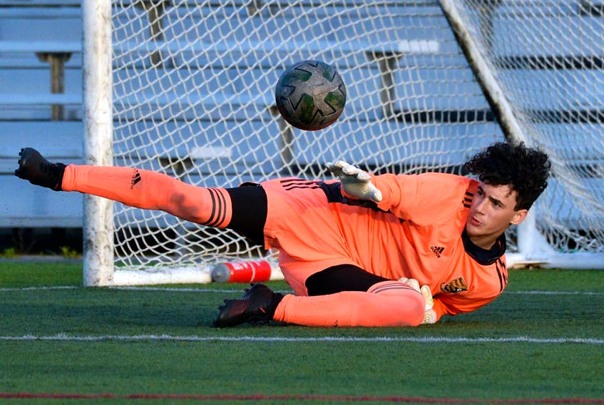 Mount Pearl keeper Ronald Collins makes a save against St. John’s in the first day of Boys Under-15 soccer action at the Team Gushue Sports Complex Wednesday night.

Keith Gosse/The Telegram