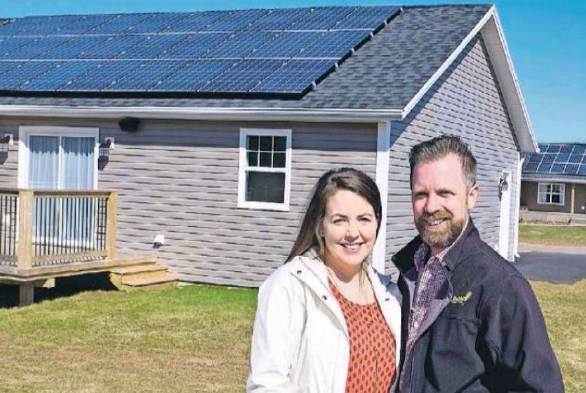<span class="art-imagetext">Matt and Katherine Eye stand in front of their solar home in P.E.I. The couple has begun a solar home company.</span>