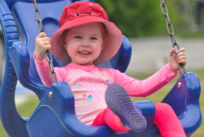Three-year-old Lucy Martin was very happy to be able to get back to enjoying the playground equipment at Margaret Bowater Park in Corner Brook Thursday. Lucy’s mom, Renee Martin, told her they couldn’t use the playground while it was closed due to COVID-19 because of the bad germs.