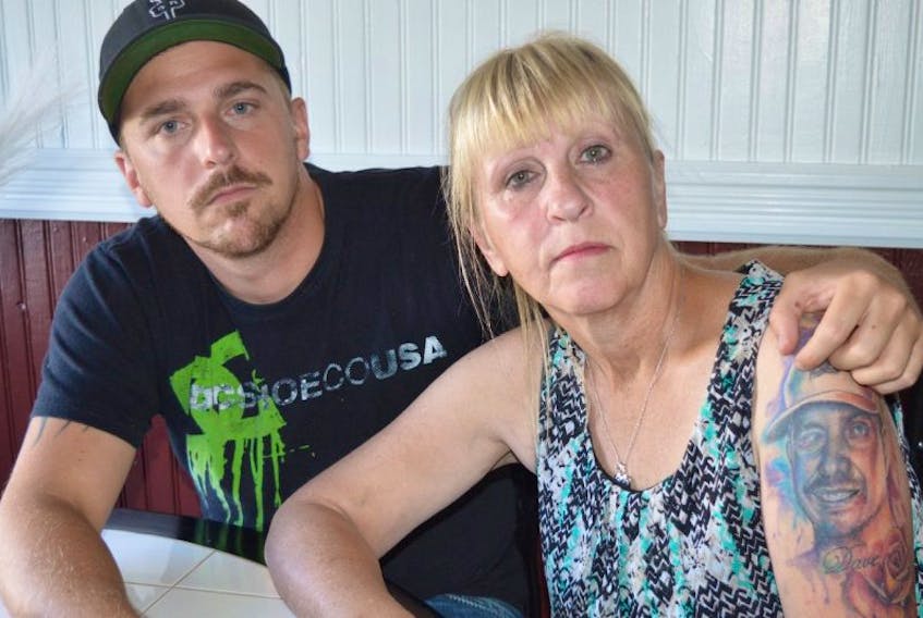 <p>Bernice Williams, of Scotchtown, is comforted by her son Archie Williams, 27. Williams said Nexen officials are blaming her late son Dave Williams and another worker for the explosion at the Long Lake facility in Fort McMurray on Jan. 15, 2016, that took both their lives. She said the company is blaming the men and she wants her son’s name cleared.</p>