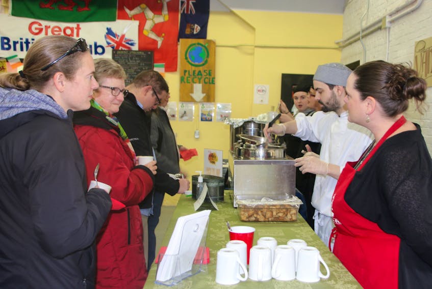 People line up to try one of the soups at the 2018 Soup Fest.