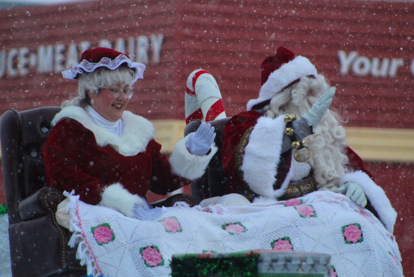 Mr. and Mrs. Claus wave to those attending Souris' 39th annual Christmas parade in 2019.
