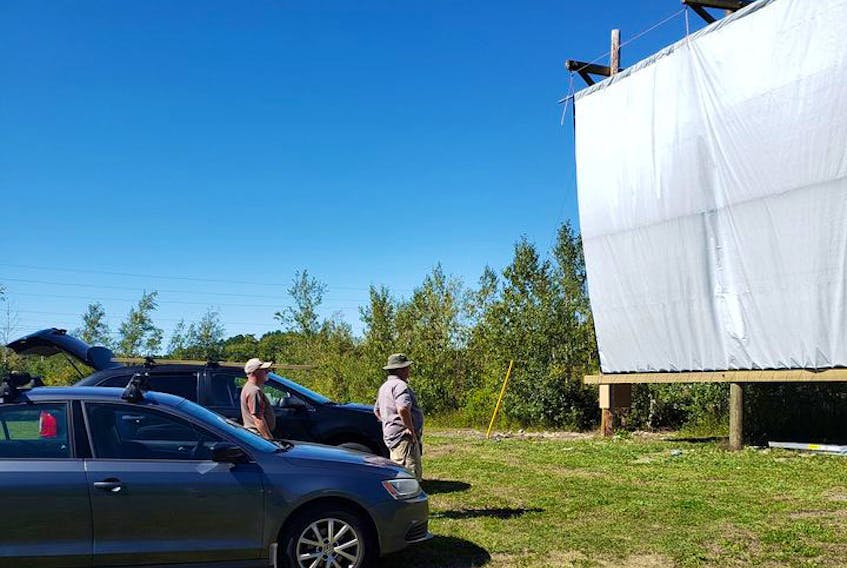 The new screen at the South Shore Drive-In’s permanent home on the grounds of the Friends of the Hank Snow property in Liverpool is given a test run.