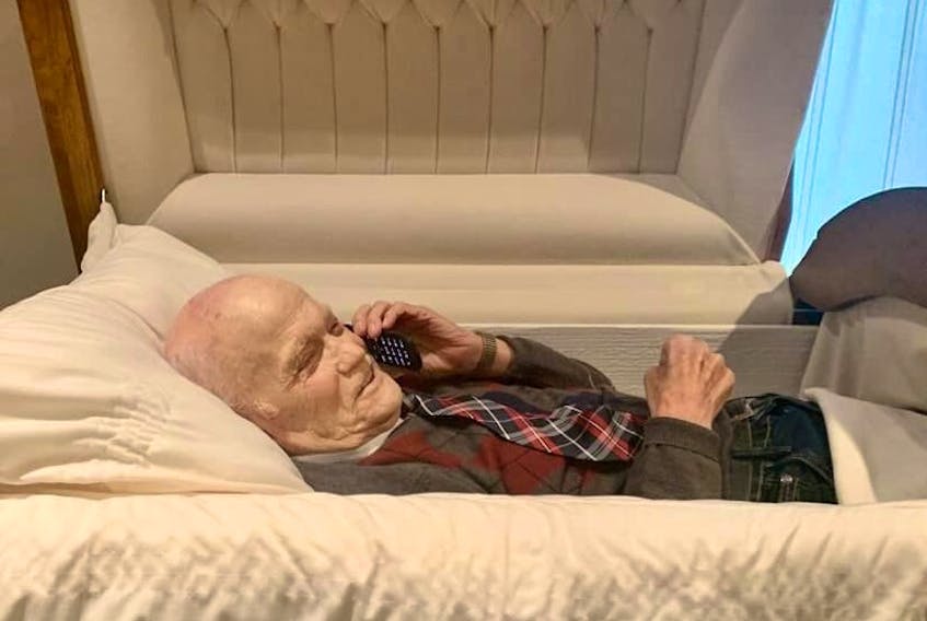 Bernard King, a 94-year-old who lives at Alderwood Estates Retirement Centre in Witless Bay, takes a call while on the set of a music video for their "nightmare version" of the Irish folk song "Finnegan's Wake." Without being able to put together their yearly haunted house, the residents still wanted to do something fun. — Submitted photo
