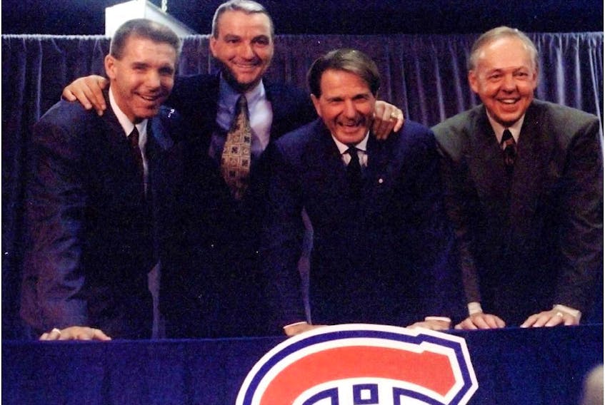 From left to right: new Canadiens GM Réjean Houle, new head coach Mario Tremblay, team president Ronald Corey and new assistant coach Yvan Cournoyer pose for photo during news conference at the Bell Centre on Oct. 21, 1995.