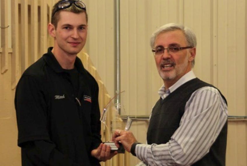 <span class="BodyText">Mitch Arsenault, left, receives the trophy after winning a regional competition for windshield repair from Norman Gauthier, director of operations for Atlantic provinces for Belron Canada.</span>