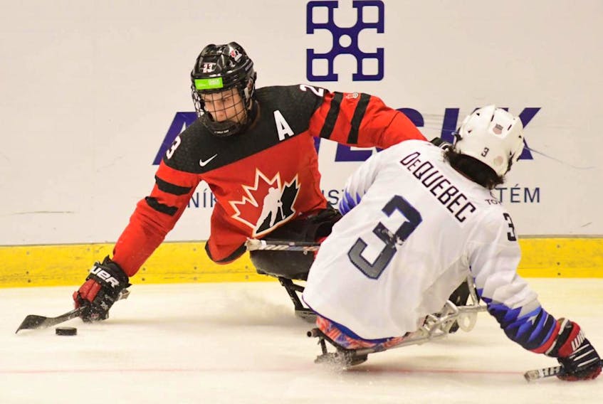 In this file photo, St. John’s native Liam Hickey (23) goes up against Ralph de Quebec of the United States in international para hockey actrion. For a third straight year, Hickey has been named Sport Newfoundland and Labrador's senior male athlete of the year..