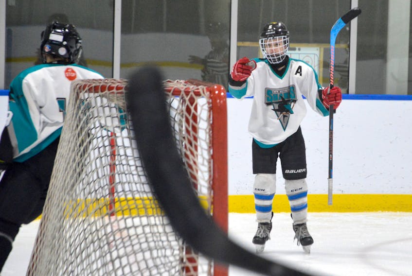 Aiden Webber of the New Waterford Sharks celebrates a goal with teammate Cohen MacDonald looking on during Cape Breton Under-13 ‘B’ Hockey League action earlier this season at the Miners Forum in Glace Bay. Teams can play games within their own leagues, however, due to COVID-19 regulations no spectators are allowed inside to watch until at least Sunday at 11:59 p.m. JEREMY FRASER • CAPE BRETON POST