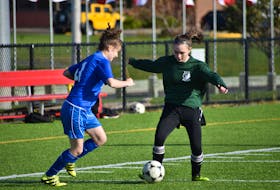 Marley MacGillivary of the Breton Education Centre Bears, right, protects the ball as Ella Greencorn pressures during Cape Breton High School Soccer League girls junior varsity action at Open Hearth Park in Sydney, in this file photo. An announcement on high school soccer has yet to be made, but with recent changes to COVID-19 guidelines, there's still hope for the soccer season. JEREMY FRASER • CAPE BRETON POST