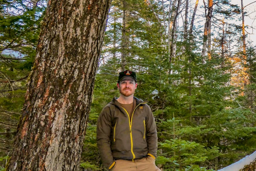Adam Malcolm, founder of the Facebook group Stop Clearcutting Unama'ki and the Instagram account @ns.speciesatrisk, in the woods near River Inhabitants, Richmond County, on Feb. 24. CONTRIBUTED