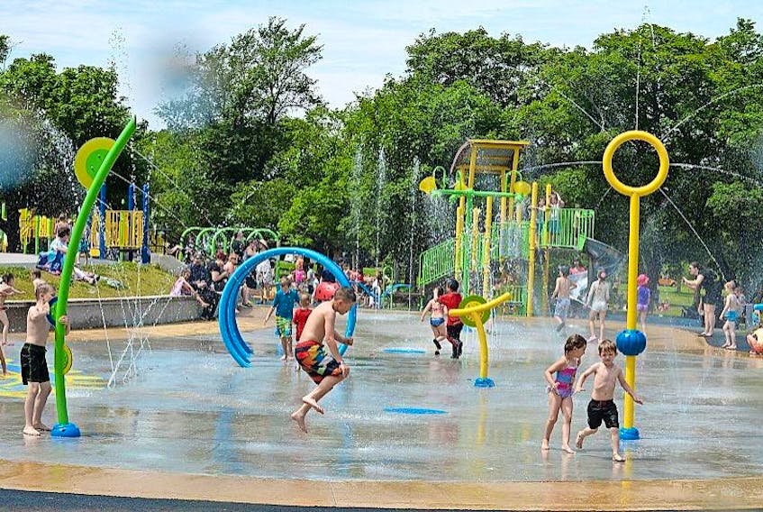<p>Children enjoy the water spray at the Bannerman Park Rotary Splash Pad.</p>