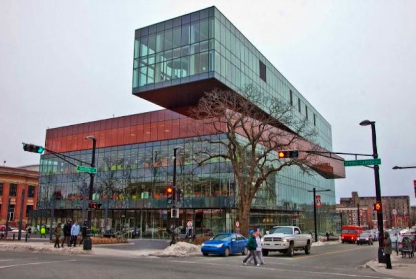 Pedestrians cross Spring Garden Road past the new Halifax Central Library.