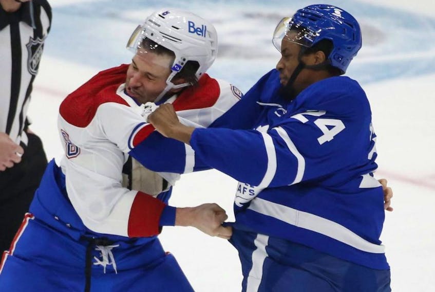 Maple Leafs forward Wayne Simmonds scraps with Ben Chiarot of the Montreal Canadiens at Scotiabank Arena on Jan. 13, 2021.