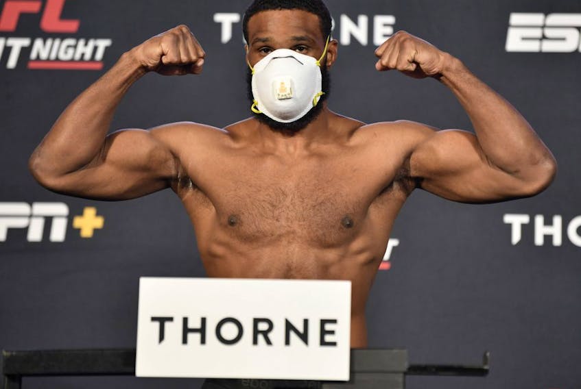 Tyron Woodley poses on the scale on May 29, 2020, during weigh ins for UFC Fight Night at the UFC APEX in Las Vegas.