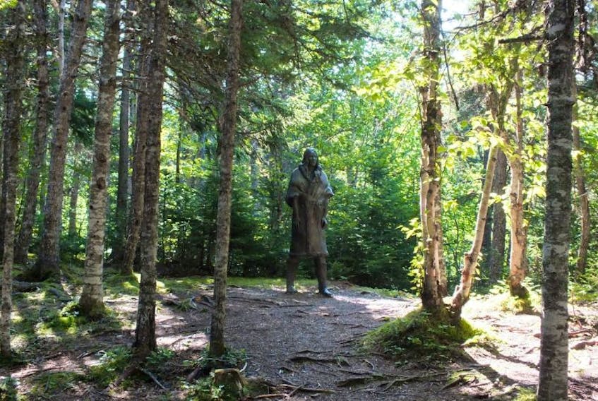 <p>Gerald Squires’ statue of Shanawdithit stands among the trees overlooking the place where the Beothuks lived hundreds of years ago in Boyd’s Cove, Newfoundland. The statue is aptly named “The Spirit of the Beothuk.”</p>