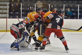 The South Shore Lumberjacks tangle with the Yarmouth Mariners in Maritime Junior A Hockey League action last fall in Yarmouth. The Lumberjacks have been purchased by a local ownership group to ensure the Lumberjacks remain in Bridgwater. Tina Comeau photo