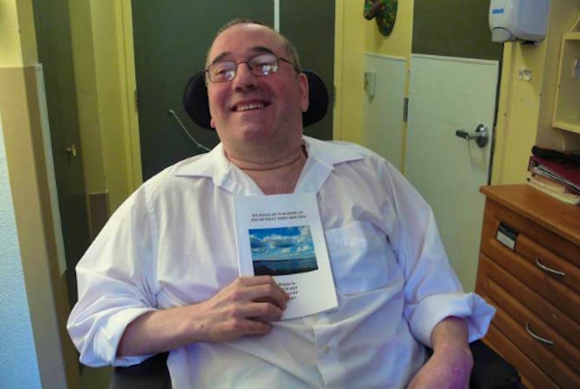 Richard Daury proudly displays his book, My Piece of Paradise in South West Port Mouton, that was launched on July 11 at Queens Manor in Liverpool.