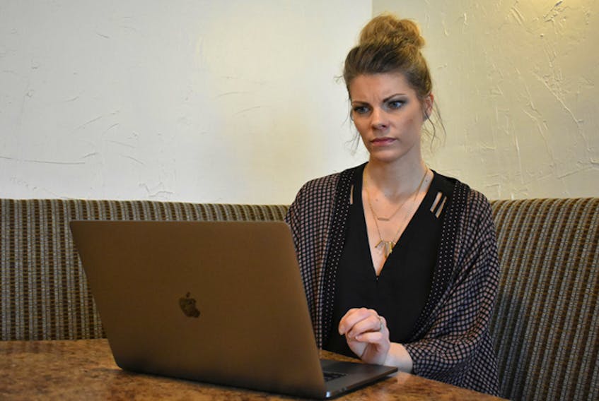Shanna Joudrey, owner of Details Events & Design Studio, frowns as she tries to access the Internet. Like many people in rural Nova Scotia, she doesn’t have access to the basic Internet speeds outlined by the CRTC.