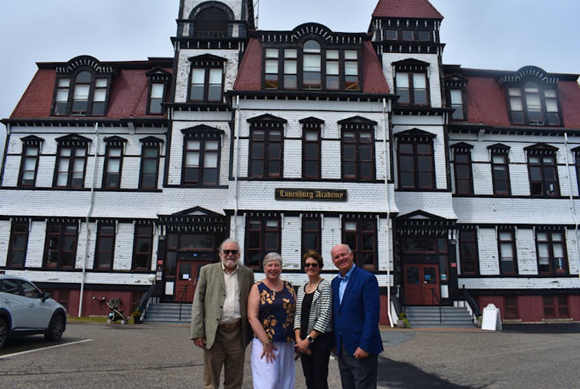From left to right: Burt Wathen of LAMP, South Shore - St Margarets MP Bernadette Jordan, Lunenburg Mayor Rachel Bailey and Tom Hayes of the Lunenburg Academy Foundation pose following an announcement for the Lunenburg Academy.
