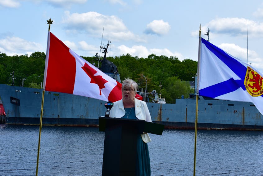 South Shore - St. Margarets MP Bernadette Jordan, to the backdrop of the HMCS Cormorant, announces a pending assessment for the ship — the first steps towards its removal.