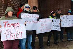 Canada Post workers demonstrated outside the Kenmount Road location on Thursday. They say temporary workers — many of whom have been with the Crown corporation for five to 10 years — receive no benefits, job security, raises or rotation of duties, which prevents repetitive strain. -JUANITA MERCER/THE TELEGRAM