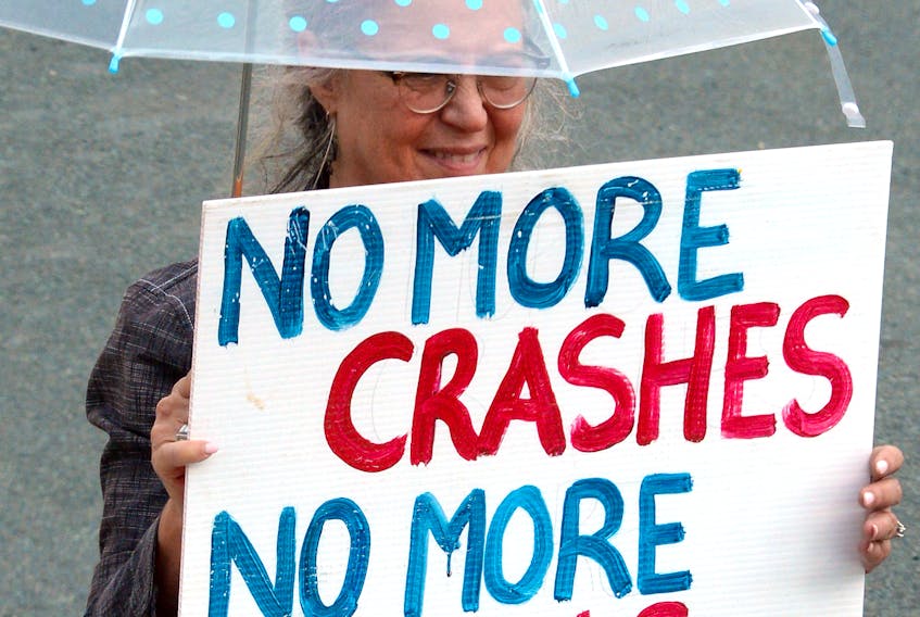 Protestors called accessible winter sidewalks a human right, and some said they would take their demands for improvements in St. John’s winter sidewalks to a higher authority if the city doesn’t make changes. Some protestors carried umbrellas to symbolize the city’s rainy day $22-million surplus, some of which should be spent on sidewalks, protestors argue. -KEITH GOSSE/THE TELEGRAM