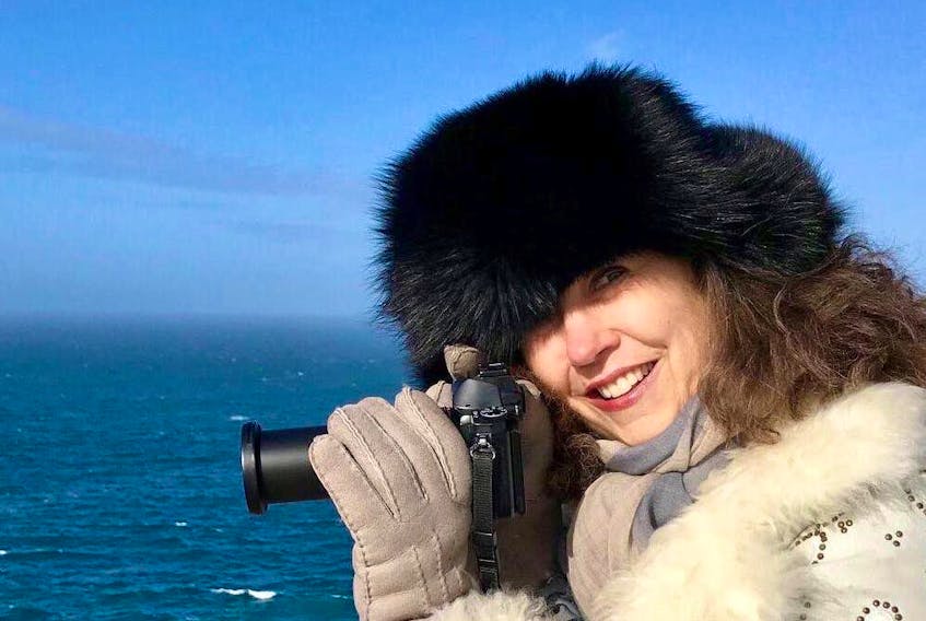 Lisa B. Sells on one of her countless photography excursions. Here she is on Marine Drive near Logy Bay in Newfoundland, but she recently returned from Antarctica, where she spent 11 days. Michelle Stamp/Contributed photo