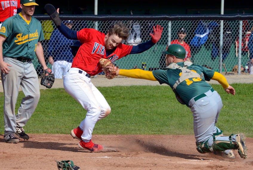 Eric McKay of the Gonzaga Vikings is tagged out at home plate by Shamrocks catcher Scott Stockley during baseball action at St. Pat’s Ball Park Saturday afternoon. It turned out the Vikings didn't need the run as they beat the Shammies 5-3 to tie the St. John's senior baseball final at a game apiece. — Keith Gosse/The Telegram