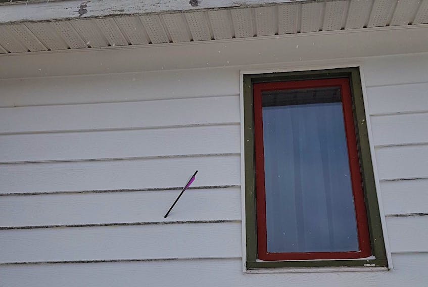 A Cowan Heights woman in St. John’s is sounding alarms after an arrow was found pierced through the side of her house. — CONTRIBUTED