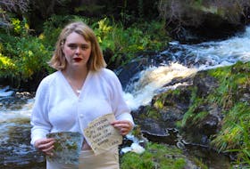 St. John’s-based writer and artist Katherine Alexandra Harvey stands near a stream in Middle Cove. She used the water from it, as well as leaves and flowers from the area, to make paper as part of “The Rewrite Project,” an art initiative she started while isolated because of the COVID-19 pandemic. – Andrew Waterman/The Telegram
