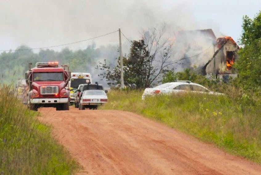 A house burns in St. Nicolas on Thursday, July 23, 2015