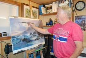 Stephenville artist Lloyd Pretty works on a painting in his studio in this file photo from 2017. - Saltwire File Photo