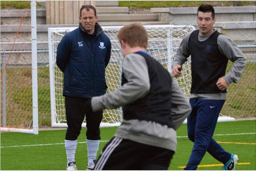 In this 2016 file photo, Feildians coach Steve Powell (left) watches as members of the Challenge Cup soccer team practise. There have been a total of 28 shutouts so far in Challenge Cup play so far in 2017, meaning goal-scoring is down dramatically. However, Powell doesn’t necessarily see that as a bad thing.