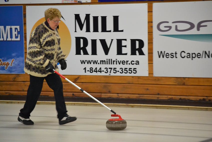 Audrey Callaghan delivers a stone during the provincial stick curling championships in Alberton on Wednesday.
