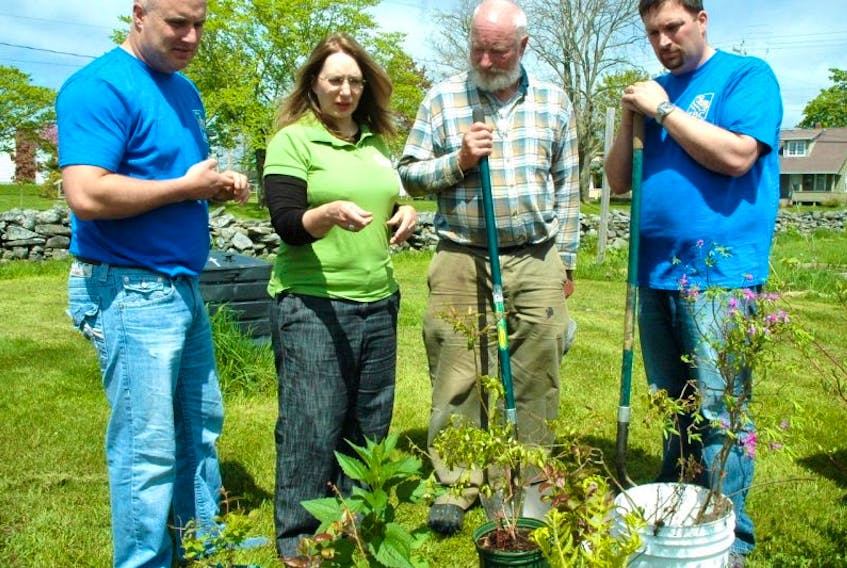 <p>At the Beacon community garden on June 4 (from left): Christopher White, RBC regional vice-president (southwestern Nova Scotia); Eleanor Royle, stormwater project coordinator with the Clean Foundation; Les Barber, coordinator of the community garden at Beacon United Church; Berton Murphy, manager of the RBC branch in Yarmouth.</p>
<p> </p>
