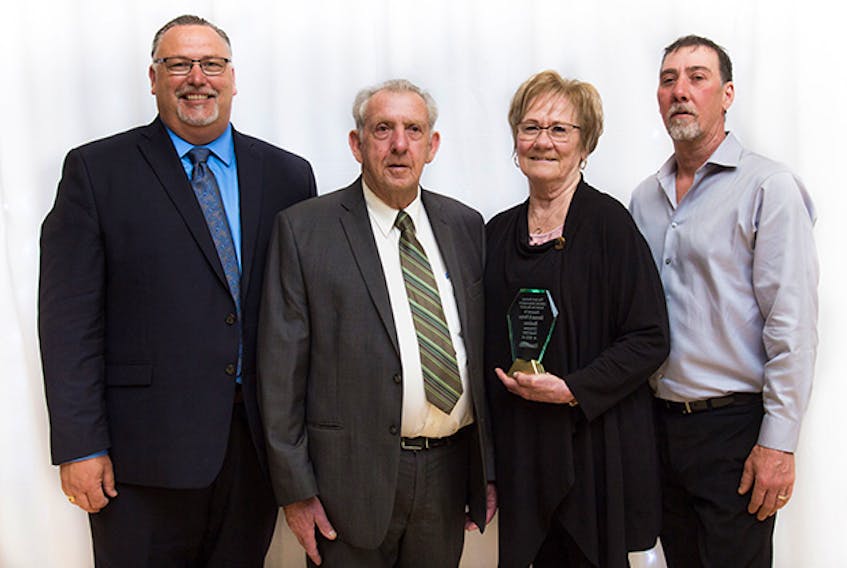 Herman and Norma Boudreau of C.H. Boudreau Funeral Home in Arichat received the Jack Hartery Lifetime Achievement Award for Business, during the Strait Area Chamber of Commerce AGM and awards gala, May 23, at the Port Hawkesbury Civic Centre. Here, they pose for a photo with their sons, Chuck (left) and Kevin (right). Contributed
