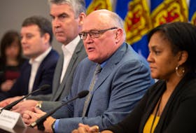 Dr. Robert Strang, Nova Scotia's chief medical officer, takes part in a COVID-19 update Friday in Halifax. From left, Health Minister Randy Delorey, Premier Stephen McNeil, Strang and Dr. Gaynor Watson-Creed, Nova Scotia's deputy chief medical officer. - Ryan Taplin