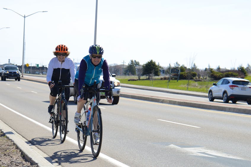 Nancy Ripley, right, and Jayne Toombs approach the North River causeway during a bike trip to Cornwall.