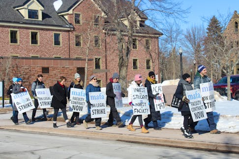 Mount Allison professors and librarians picket along York Street in Sackville in front of the university campus on Monday, the first day of the strike by the faculty.