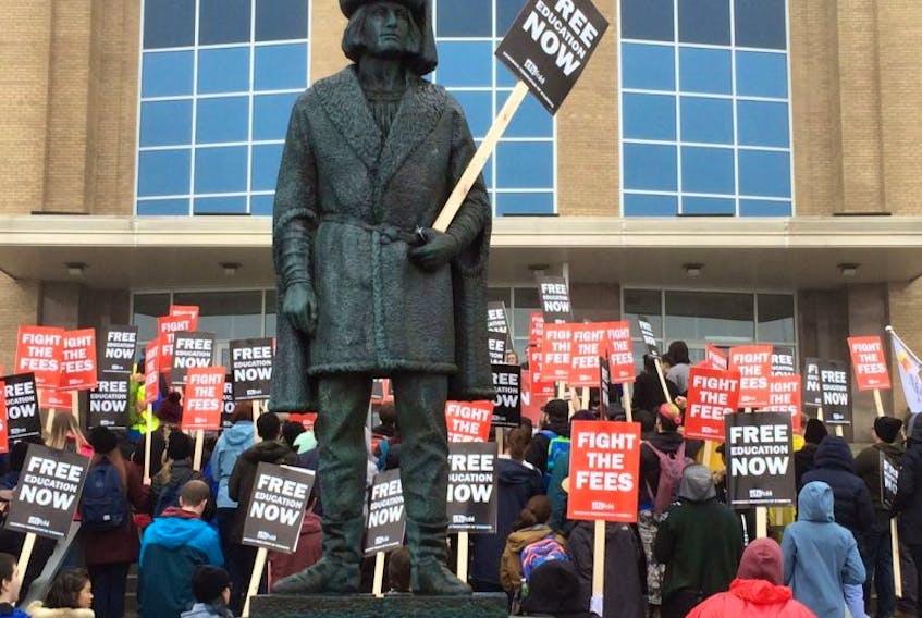 Students have enlisted the John Cabot statue in their protest on Confederation Hill.