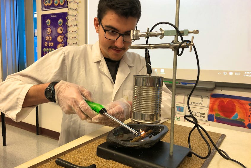 Nicholas Flowers, a Grade 12 student at Amos Comenius Memorial School in Hopedale, Labrador, has worked several months on his science project, which evaluates the fuel value and efficiency of burning seal oil (known as Utsuk in Inuksuk) in soapstone lamps (Kullik), which he said were used by his family’s ancestors for many centuries. — CONTRIBUTED