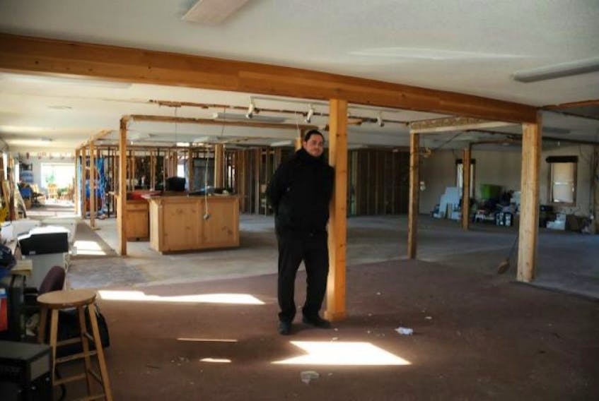 <p><span class="Normal">Brad Cook, resident pro and manager of the Summerside Golf and Country Club, looks over the hollowed shell of the clubhouse. The facility’s new owner recently started renovations to the building, which he plans to complete in time for a grand opening this spring.</span></p>