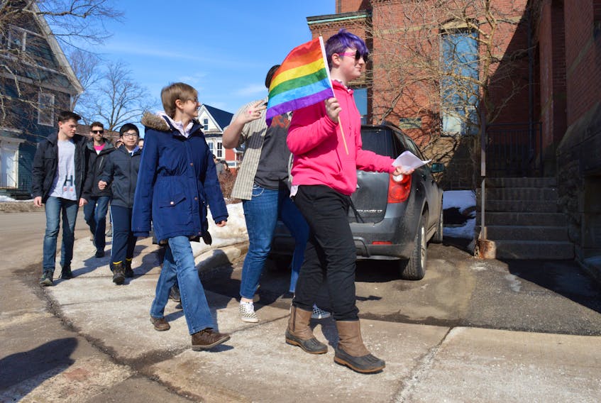 Henry McInnis, in pink, leads a group of students from Summerside Intermediate School to City hall for the city's first anti-bullying flag raising. Alison Jenkins/Journal Pioneer